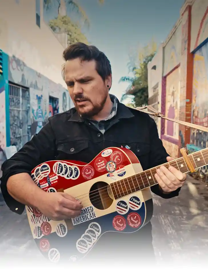 The Sam Chase, standing in the Mission surrounded by Graffiti - portrait size